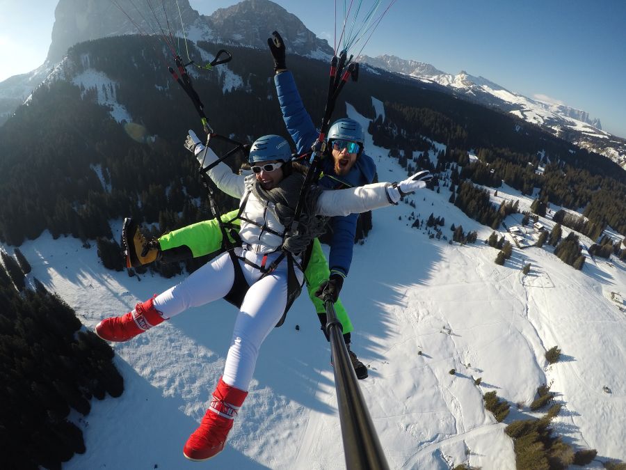 Paragliding during ski season, Dolomites, Italy